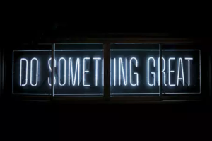 Do Something Great written in neon lights.
